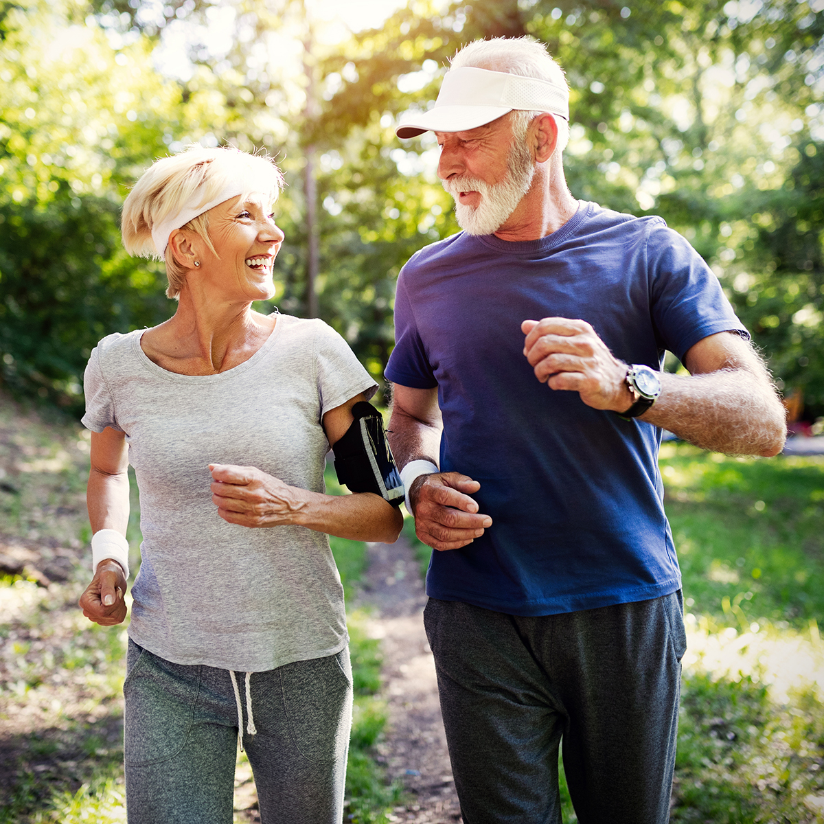 two seniors power walking